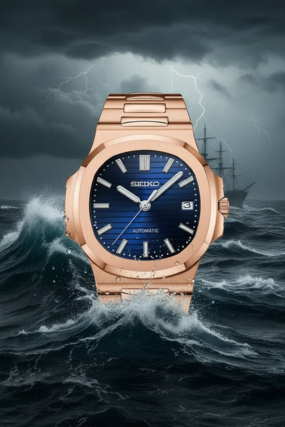 A Rolex watch with a rose gold-toned stainless steel case and integrated bracelet, featuring a deep blue sunburst dial with silver-tone indices and hands.