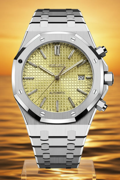 Silver watch with a yellow face on a black background