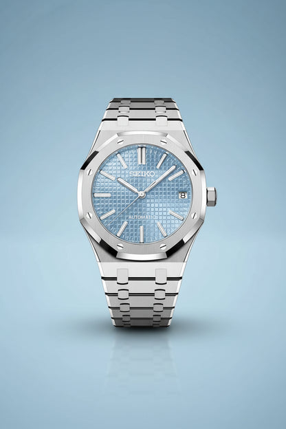 Seiko watch with blue face and silver metal strap on a black background