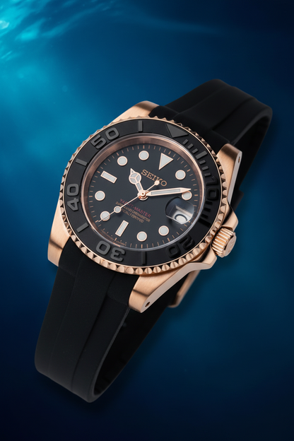 A close-up of a Seiko Yacht-Master automatic chronograph watch with a black dial, black bezel, and rose gold case and strap.