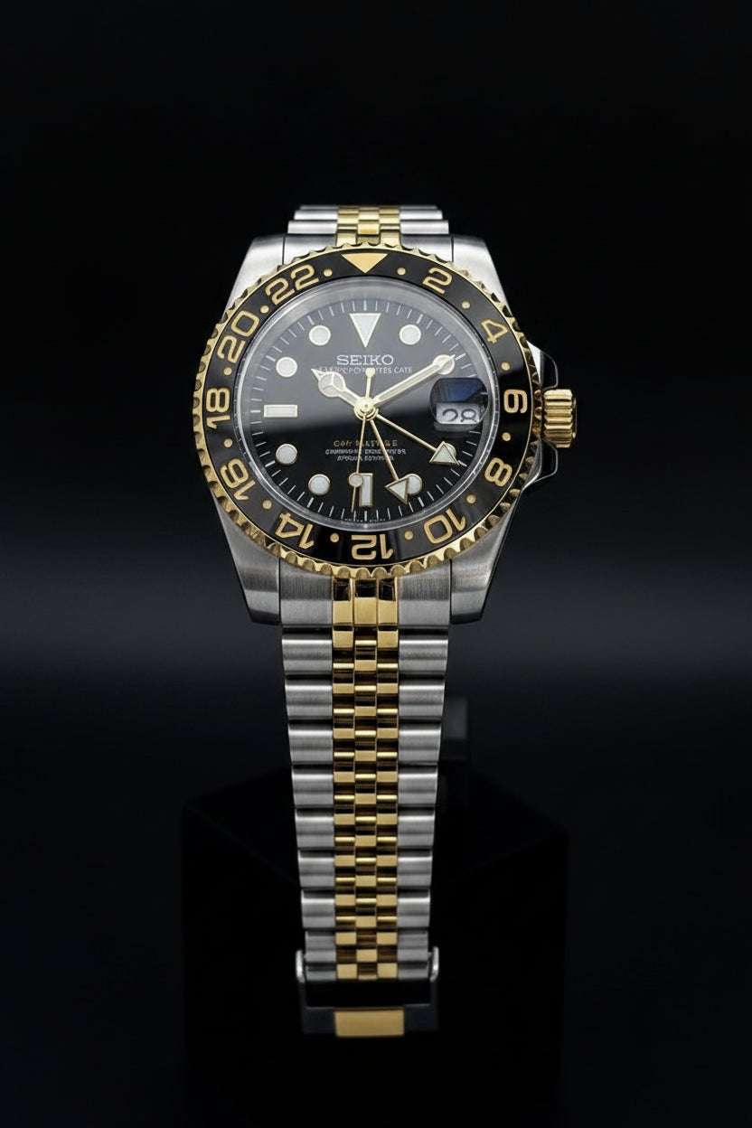 Seiko watch with two-tone metal strap on a gray background
