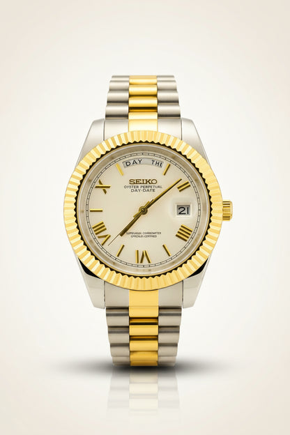 A Seiko Oyster Perpetual watch with a two-tone gold and silver stainless steel bracelet and fluted bezel, displayed inside a gold velvet watch box.